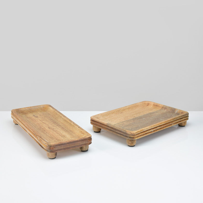 Two wooden trays on a white background